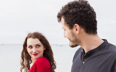 happy woman with man sea shore